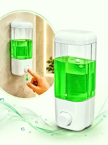 Dispenser de parede branco e transparente com líquido verde e mão apertando o botão, foto do anúncio do produto no Mercado Livre