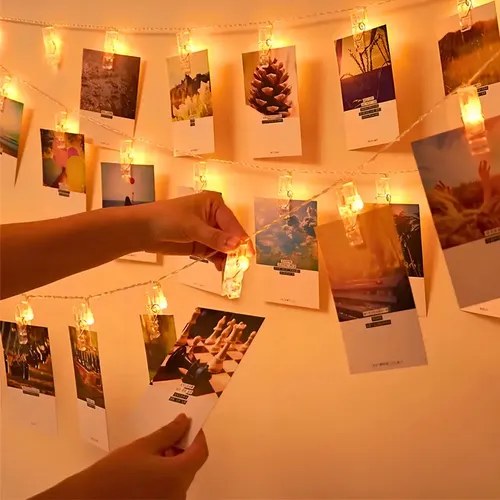 Varal de luzes com fotos penduradas por pregadores, foto do anúncio do produto no Mercado Livre