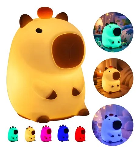 Luminária amarela de silicone em formato de capivara e variações acesas em outras cores, foto do anúncio do produto no Mercado Livre
